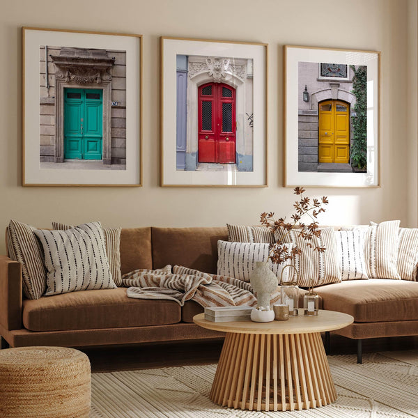 Colorful three piece wall art featuring bold architectural doors in red, teal, and yellow tones.