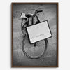 Black and white Florence street photography featuring a vintage bicycle and designer shopping bag near Via della Vigna Nuova