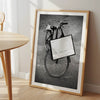 Black and white Florence street photography featuring a vintage bicycle and designer shopping bag near Via della Vigna Nuova