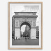 A Black and white architectural photograph print of Washington Square Arch in Greenwich Village, New York City, with people playing soccer in the foreground.