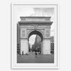 A Black and white architectural photograph print of Washington Square Arch in Greenwich Village, New York City, with people playing soccer in the foreground.