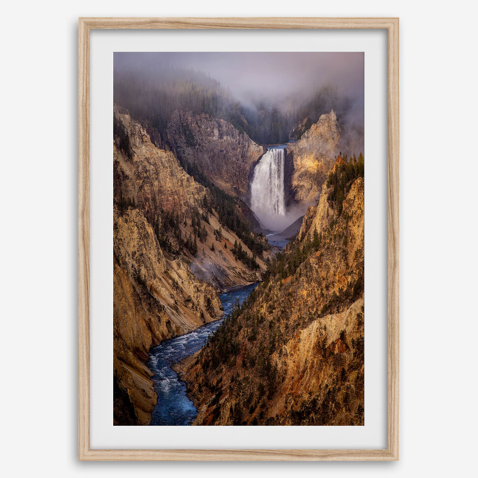 Painterly landscape photograph of the Grand Canyon of the Yellowstone with mist and waterfall.