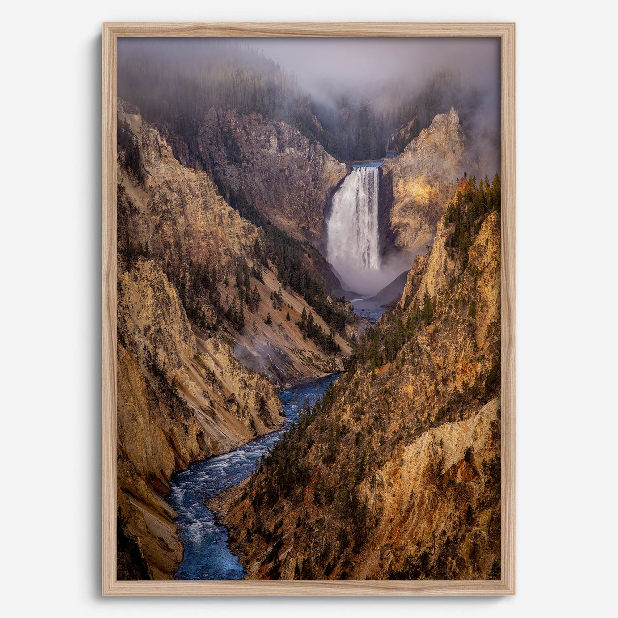 Painterly landscape photograph of the Grand Canyon of the Yellowstone with mist and waterfall.