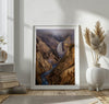 Painterly landscape photograph of the Grand Canyon of the Yellowstone with mist and waterfall.