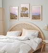 A wall art set of 3 framed or unframed Joshua Tree National Park prints. This desert wall art showcases a stunning Joshua Tree and the desert terrain and plants in a breathtaking Pink sunset filled with Pink and Purple hues. Modern gallery wall set