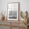 A black and white fine art lake beach print of a beach in Chicago on the coast of Lake Michigan showcasing a woman bathing in the lake. The classic modern look of the print is sure to impress when hung on your walls.