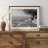 Black and white coastal art featuring Pebble Beach’s rocky shoreline and ocean view.
