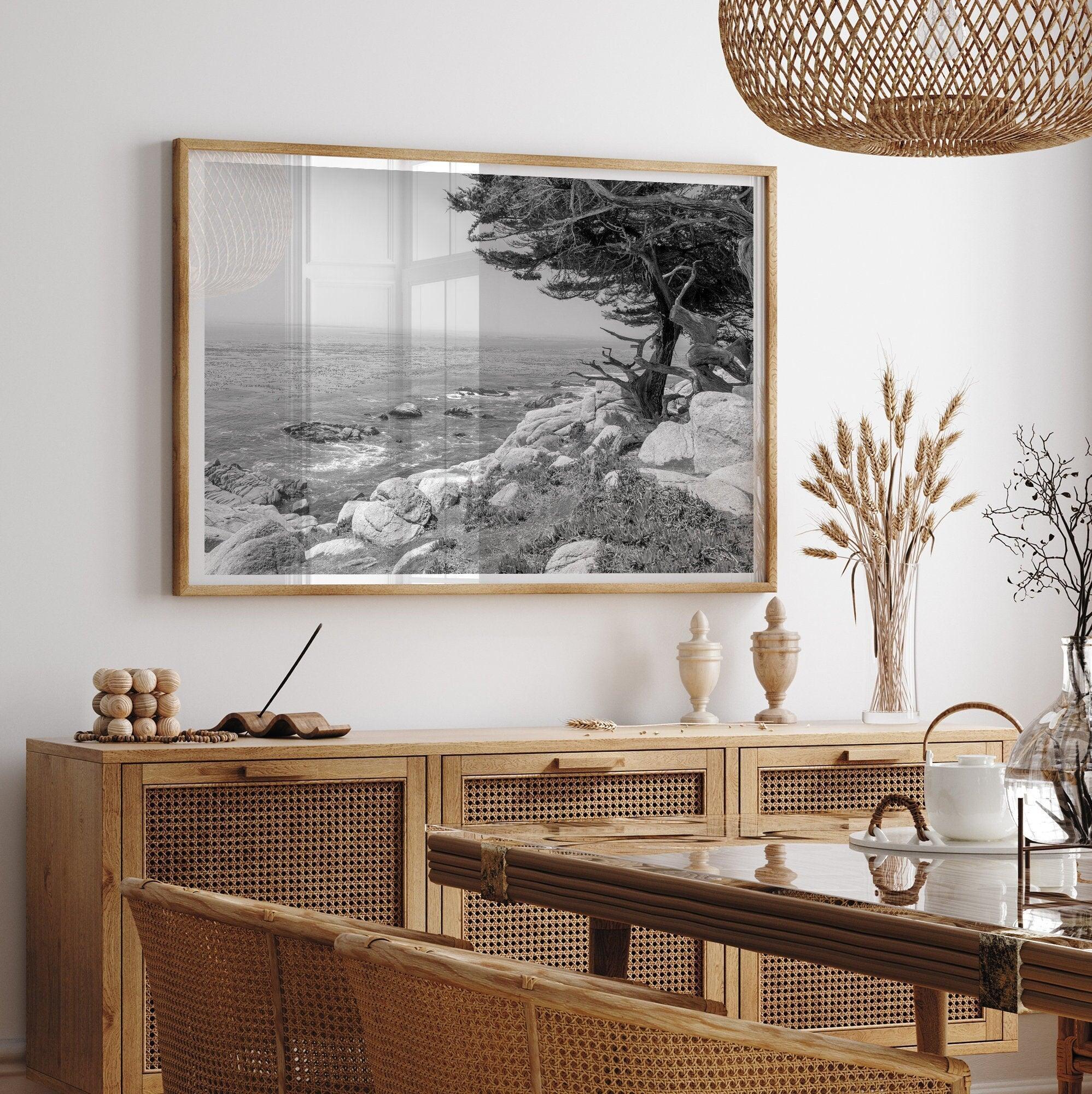 Black and white coastal art featuring Pebble Beach’s rocky shoreline and ocean view.