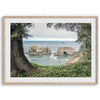 This stunning coastal photo was taken in Samuel H. Boardman State Scenic Corridor in Oregon. This ocean wall art shows unique rock formations in a vast blue Pacific Ocean through a window created from coastal trees and plants.