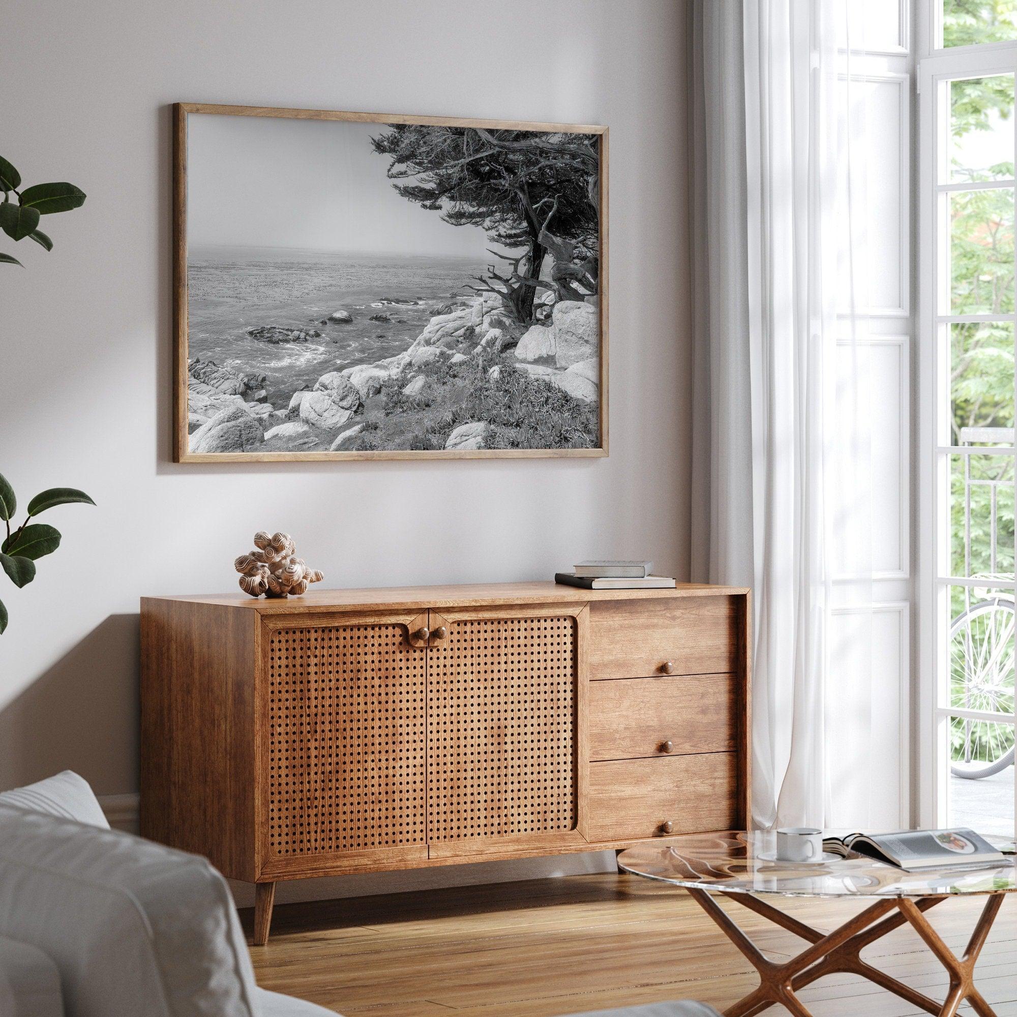 Black and white coastal art featuring Pebble Beach’s rocky shoreline and ocean view.