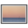This stunning fine art ocean sunset photography print features a breathtaking scene of a boat against a golden and pink sky at sunset. The warm glow of the sunset and the natural beauty of the ocean and sky combine to create a soothing atmosphere.