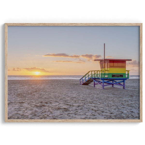 A fine art colorful Los Angeles print featuring Venice Beach at Sunset. This stunning California beach wall art features the famous lifeguard towers of Venice Beach at sunset with the ocean in the backdrop.