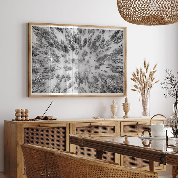 Snowy forest wall art with aerial photography of snow-covered trees in winter.